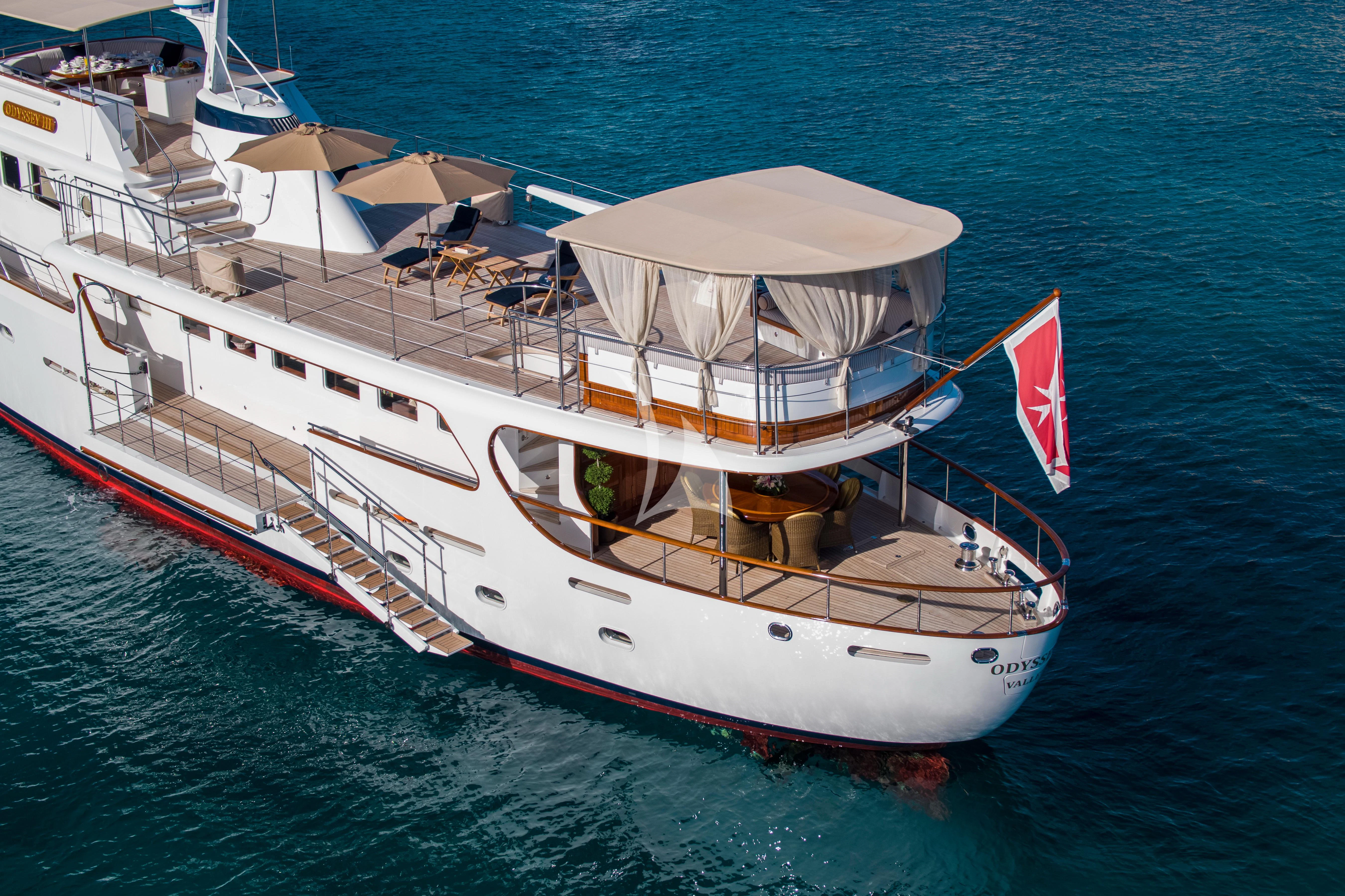a large white boat on the water aboard ODYSSEY III Yacht for Sale