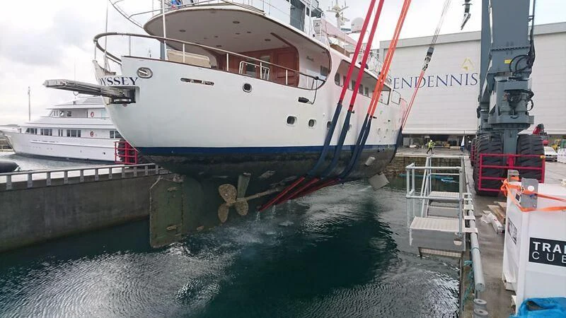 a large white boat docked at a dock aboard ODYSSEY III Yacht for Sale