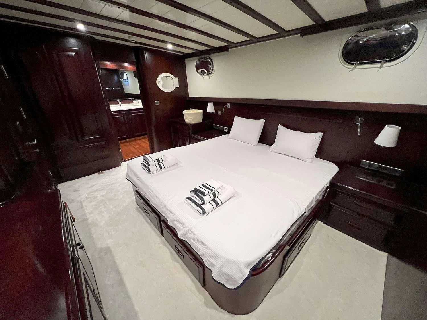 a bed in a room aboard ALWAYS SMILE Yacht for Charter