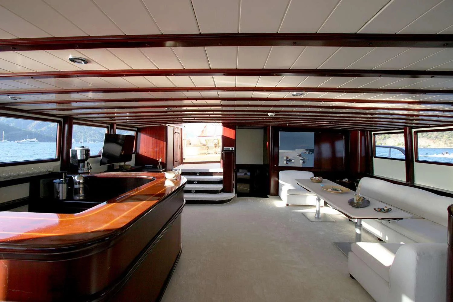 inside of a building with a large window and a large open door aboard ALWAYS SMILE Yacht for Charter