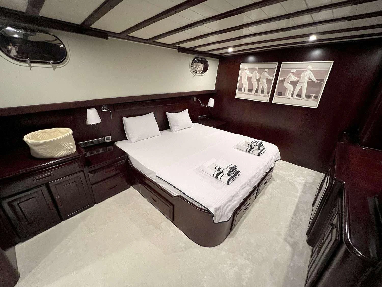 a bed in a room aboard ALWAYS SMILE Yacht for Charter