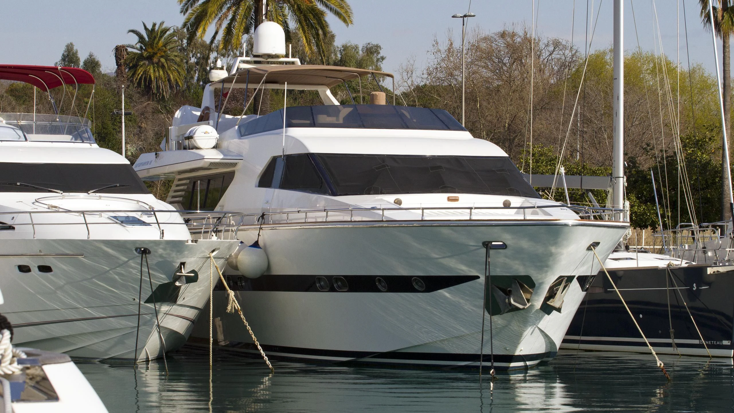 a couple of boats sit in a harbor aboard CASCAIS M Yacht for Sale