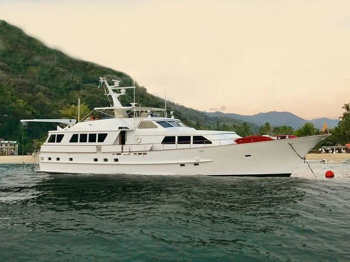 a white yacht in the water aboard ALL OF ME Yacht for Sale