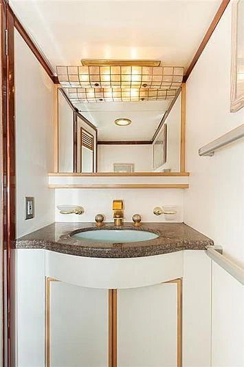 a bathroom with a sink and a mirror aboard ALL OF ME Yacht for Sale