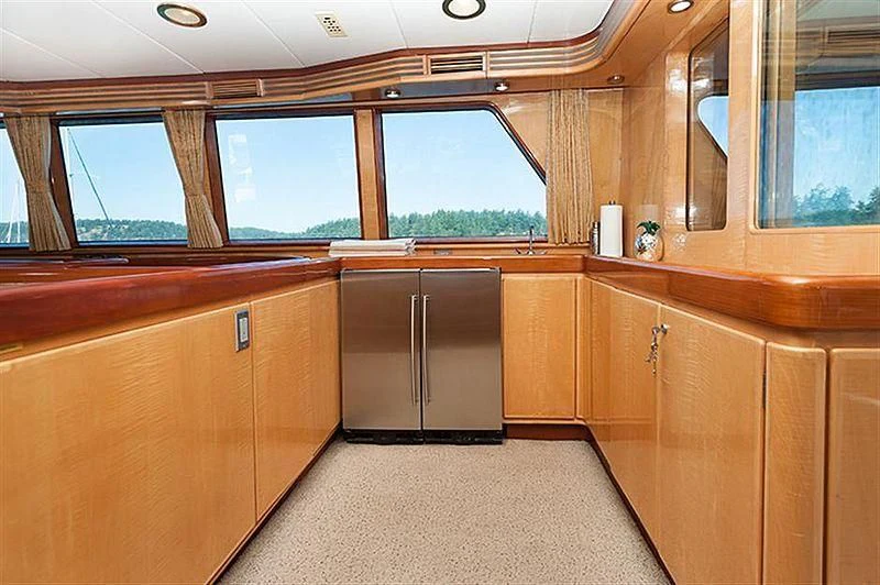 a room with wooden cabinets aboard ALL OF ME Yacht for Sale