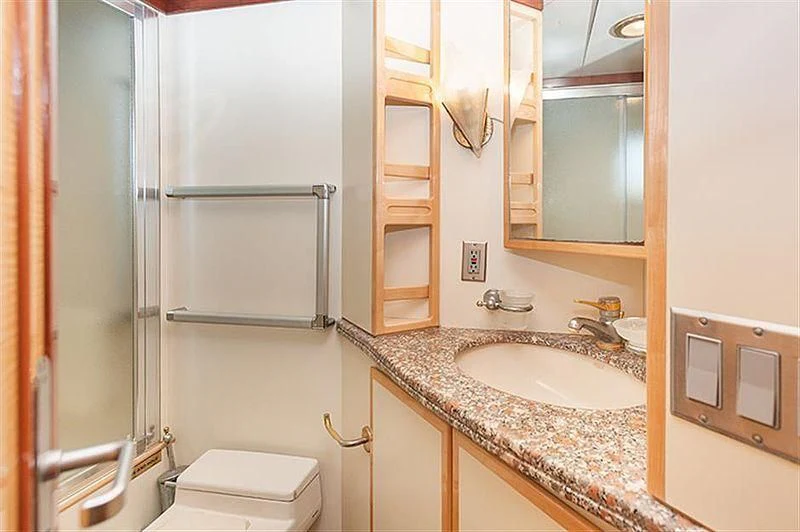 a bathroom with a sink and a mirror aboard ALL OF ME Yacht for Sale