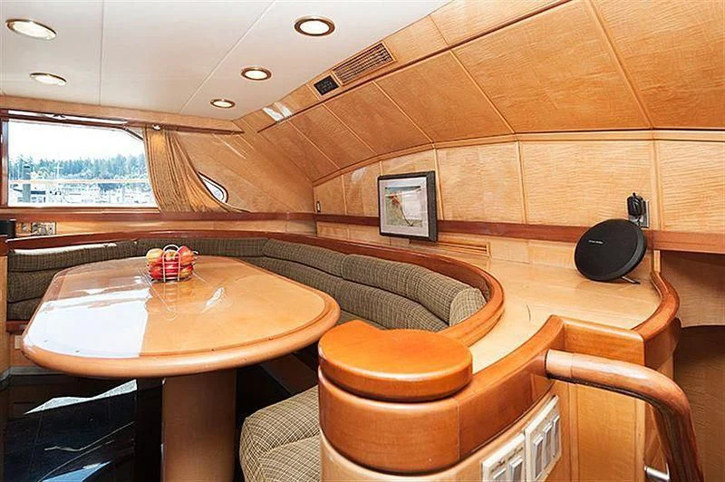 a table and chairs in a room aboard ALL OF ME Yacht for Sale