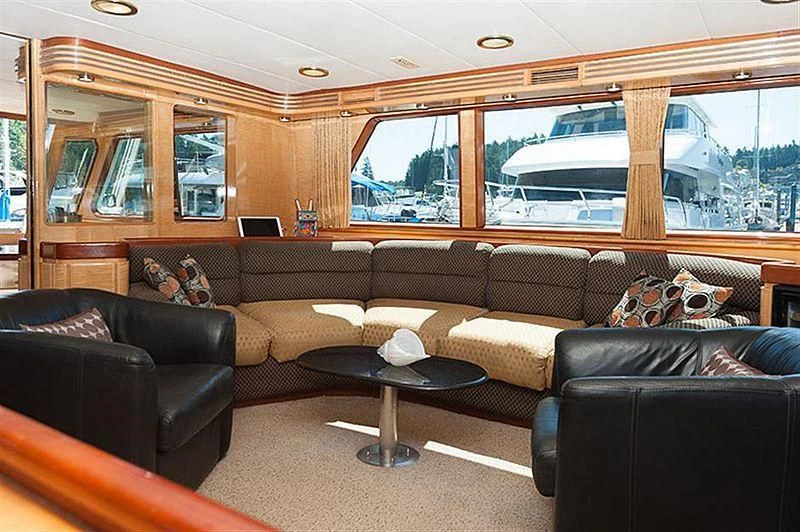 a living room with leather couches aboard ALL OF ME Yacht for Sale