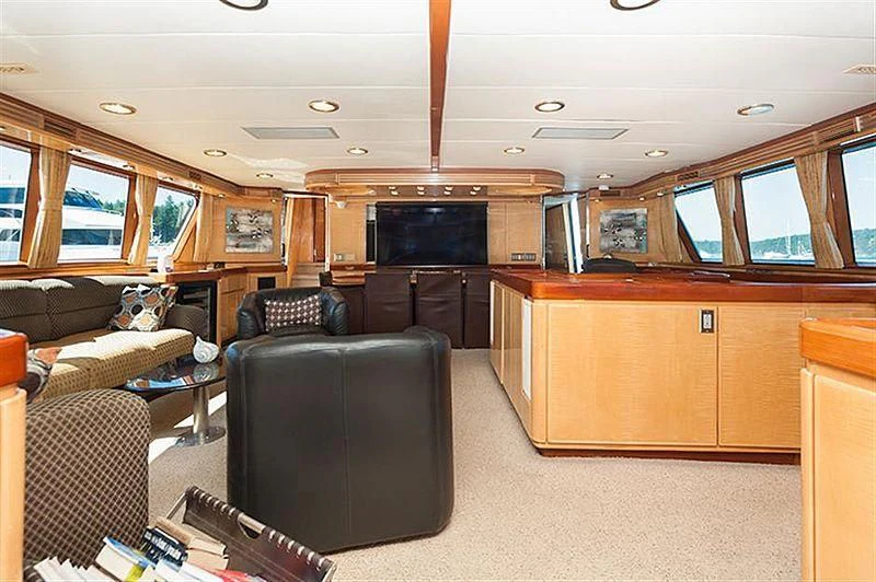 a living room with a couch and a tv aboard ALL OF ME Yacht for Sale