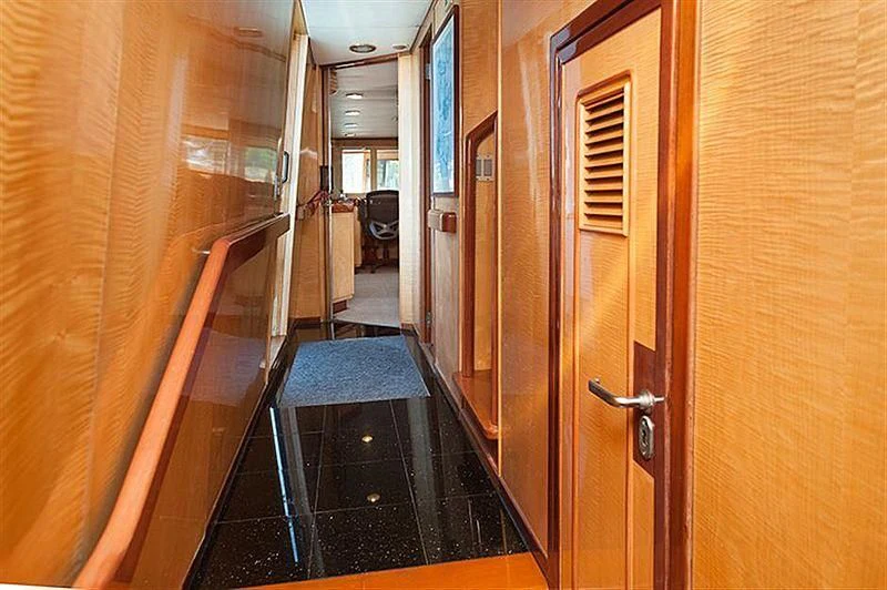 a hallway with a door and a glass door aboard ALL OF ME Yacht for Sale