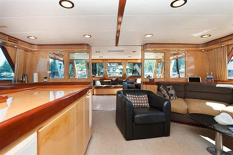 a living room with leather couches aboard ALL OF ME Yacht for Sale