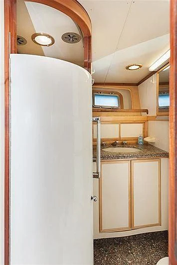 a bathroom with a white door aboard ALL OF ME Yacht for Sale