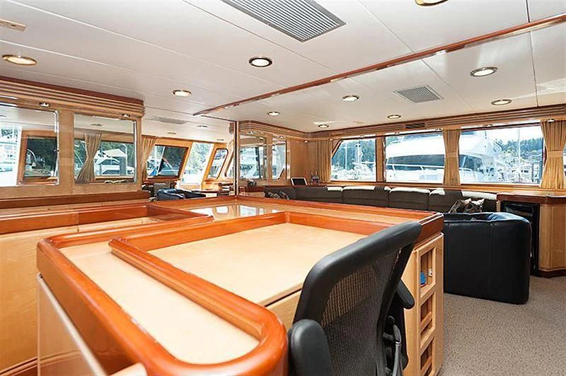 a room with a table and chairs aboard ALL OF ME Yacht for Sale