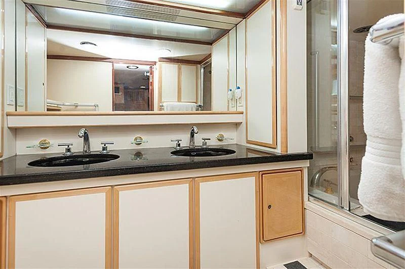 a bathroom with a sink and a mirror aboard ALL OF ME Yacht for Sale