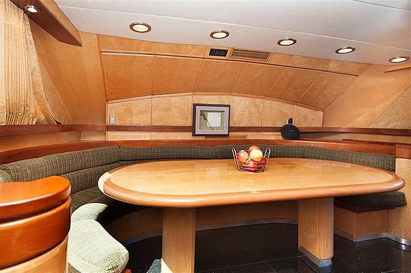 a kitchen with a table and chairs aboard ALL OF ME Yacht for Sale