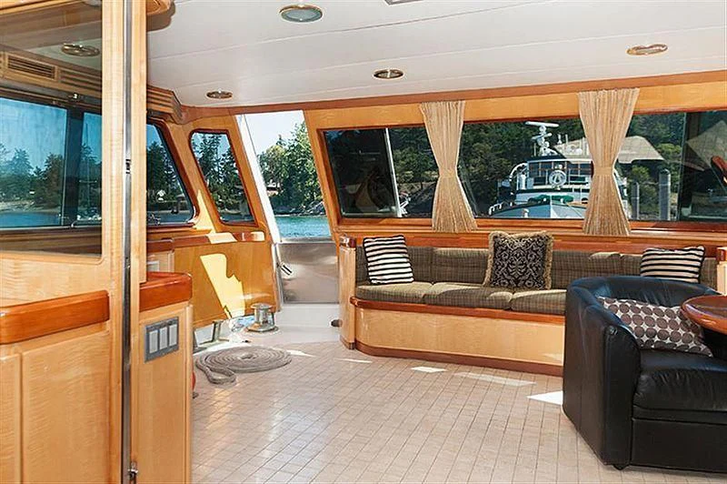 a living room with leather couches aboard ALL OF ME Yacht for Sale
