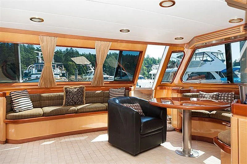 a living room with a couch and a table aboard ALL OF ME Yacht for Sale