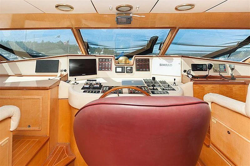 a room with a red chair and a desk with a computer on it aboard ALL OF ME Yacht for Sale