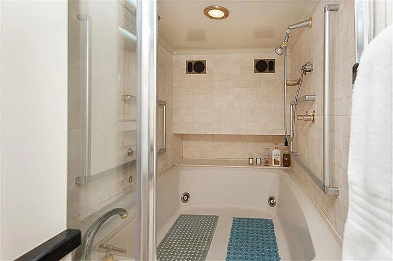 a bathroom with a tub and shower aboard ALL OF ME Yacht for Sale