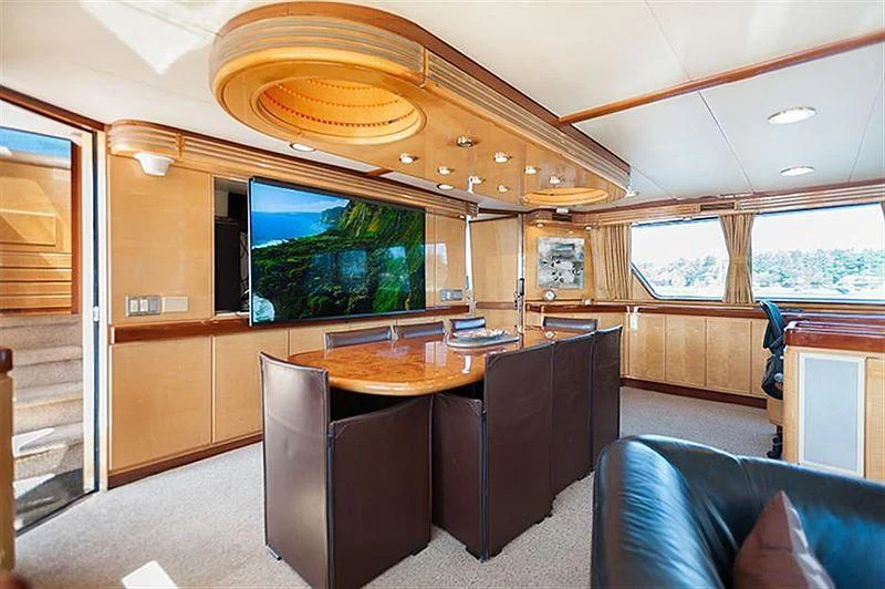 a room with a table and chairs aboard ALL OF ME Yacht for Sale