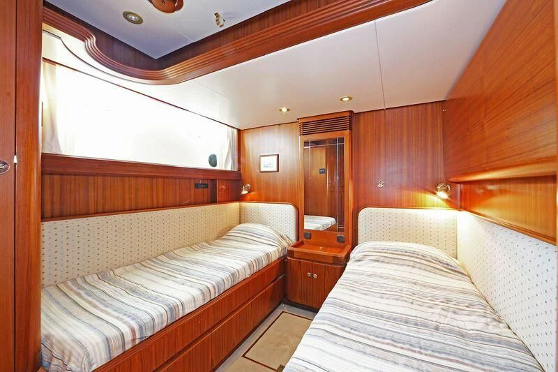 a room with two beds aboard HIDE N SEA Yacht for Sale