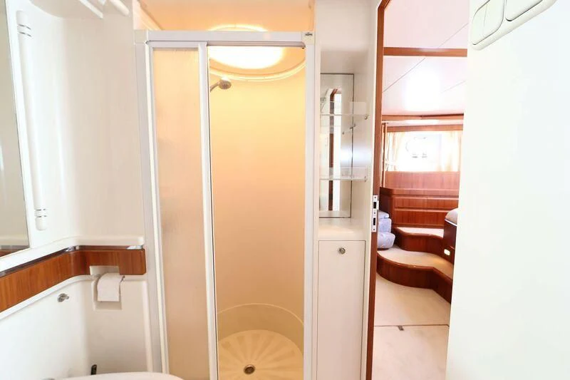 a bathroom with a tub sink and a shower aboard HIDE N SEA Yacht for Sale