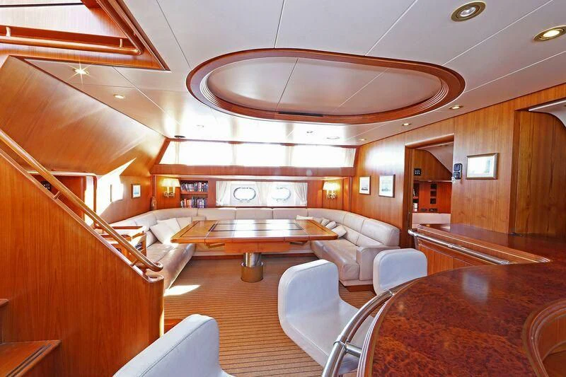 a large room with a table and chairs aboard HIDE N SEA Yacht for Sale