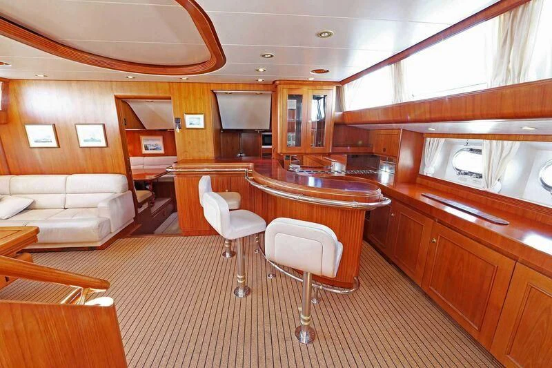 a large kitchen with a dining table aboard HIDE N SEA Yacht for Sale