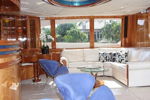 a living room with a couch and a table aboard AZURE II Yacht for Sale