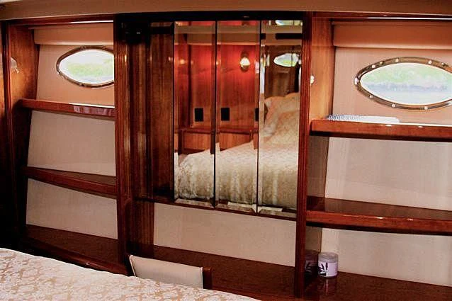 a room with a mirror and a bed aboard AZURE II Yacht for Sale