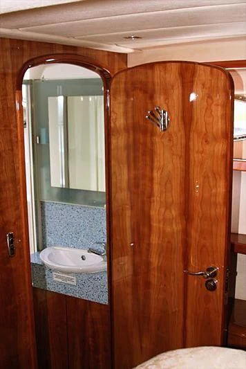 a bathroom with a sink and a mirror aboard AZURE II Yacht for Sale
