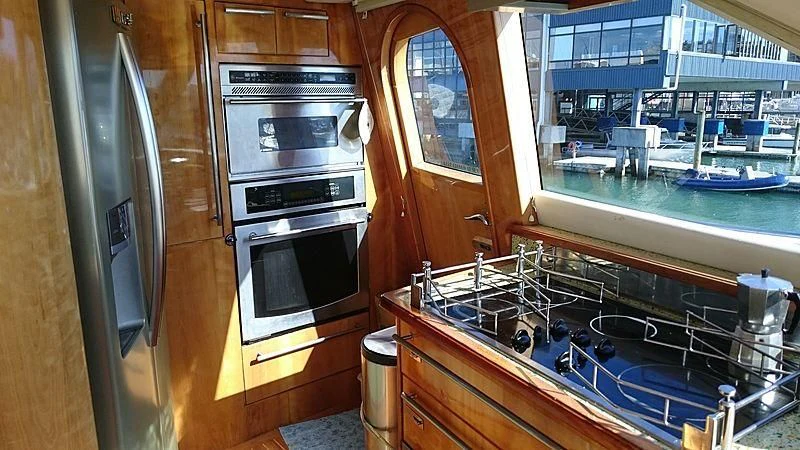 a kitchen with a stove and oven aboard AZURE II Yacht for Sale