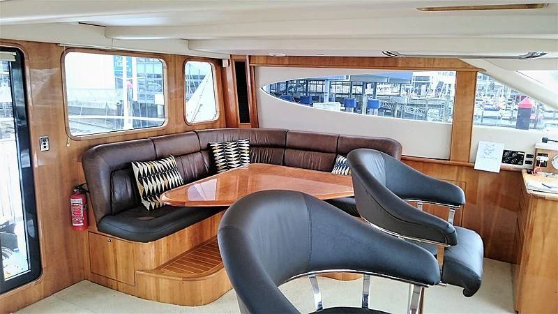 a room with a couch and a table aboard AZURE II Yacht for Sale