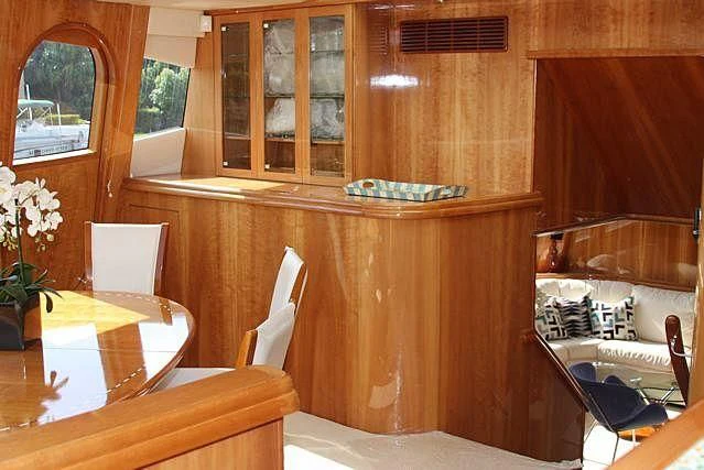 a kitchen with a table and chairs aboard AZURE II Yacht for Sale