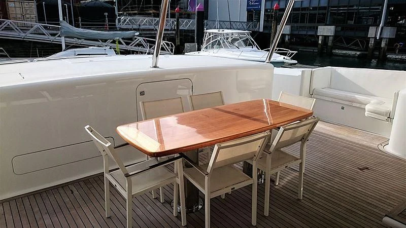 a table with chairs around it aboard AZURE II Yacht for Sale