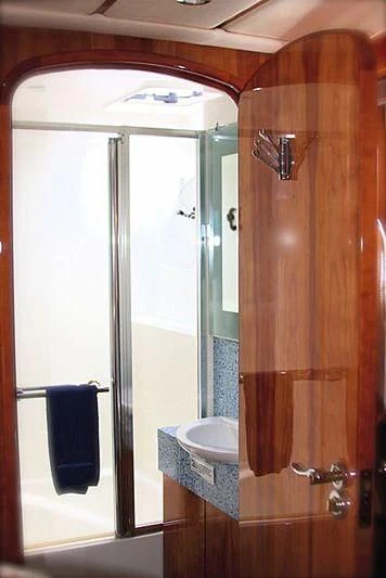 a bathroom with a shower unit and a sink aboard AZURE II Yacht for Sale