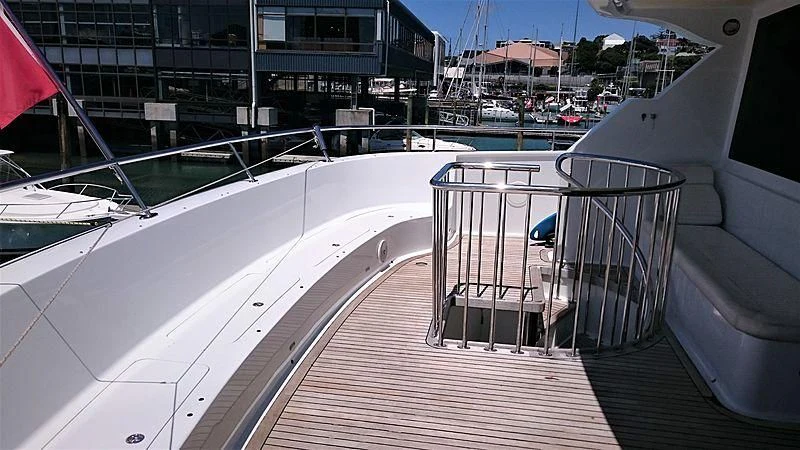 a deck with a railing and a railing with a building and blue sky aboard AZURE II Yacht for Sale
