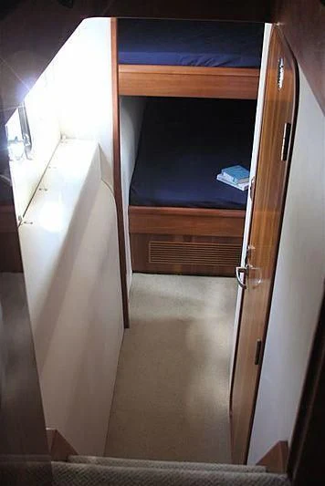 a wooden bunk bed aboard AZURE II Yacht for Sale