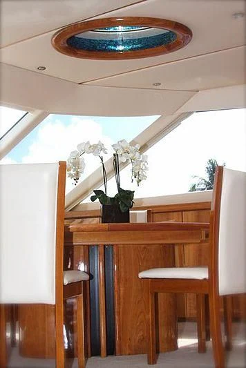 a vase of flowers on a table aboard AZURE II Yacht for Sale