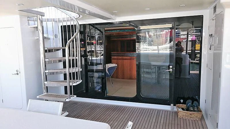 a room with glass doors and a ladder aboard AZURE II Yacht for Sale
