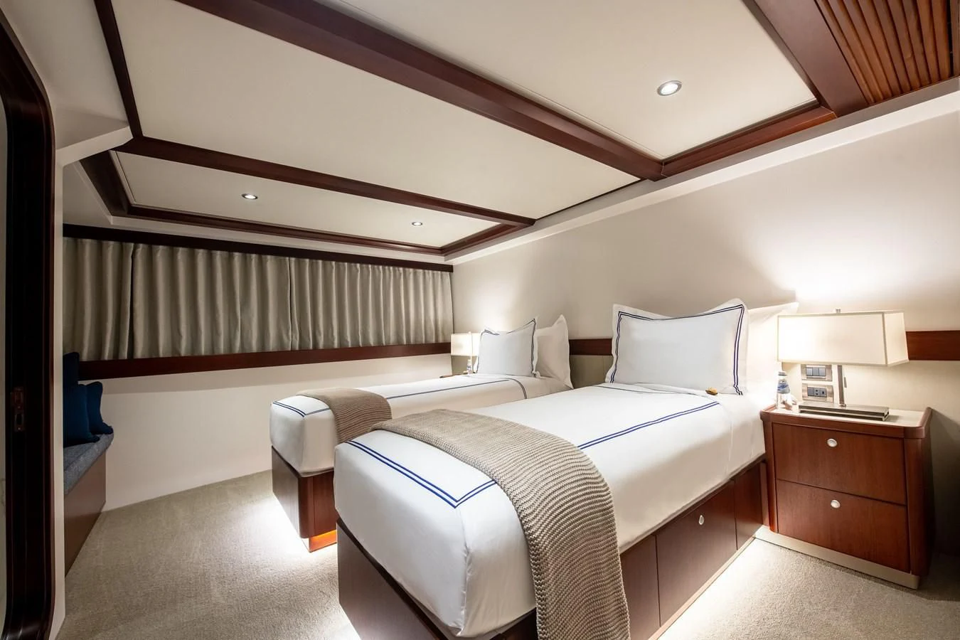 a room with two beds aboard LATITUDE Yacht for Sale