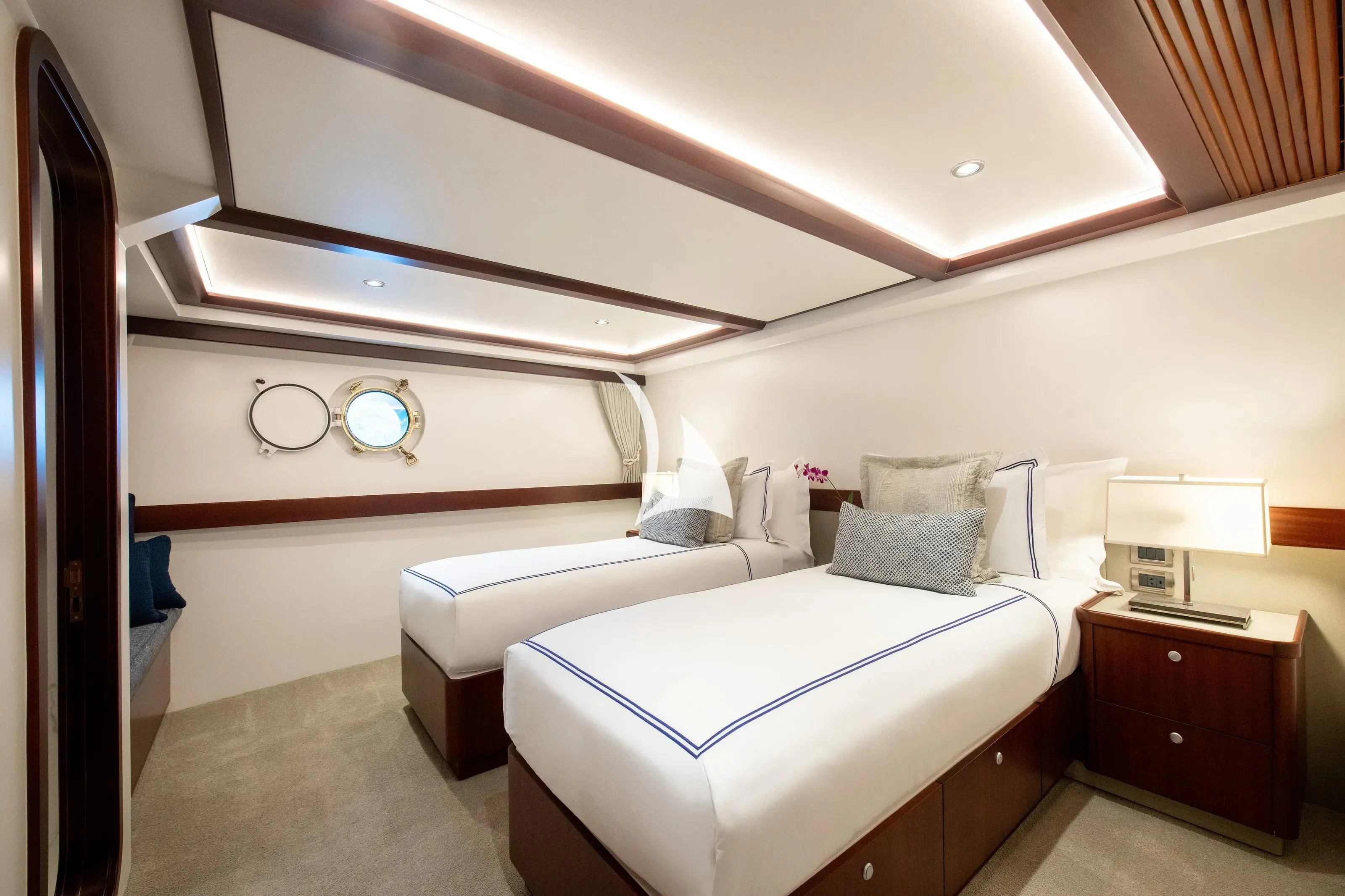 a room with two beds aboard LATITUDE Yacht for Sale