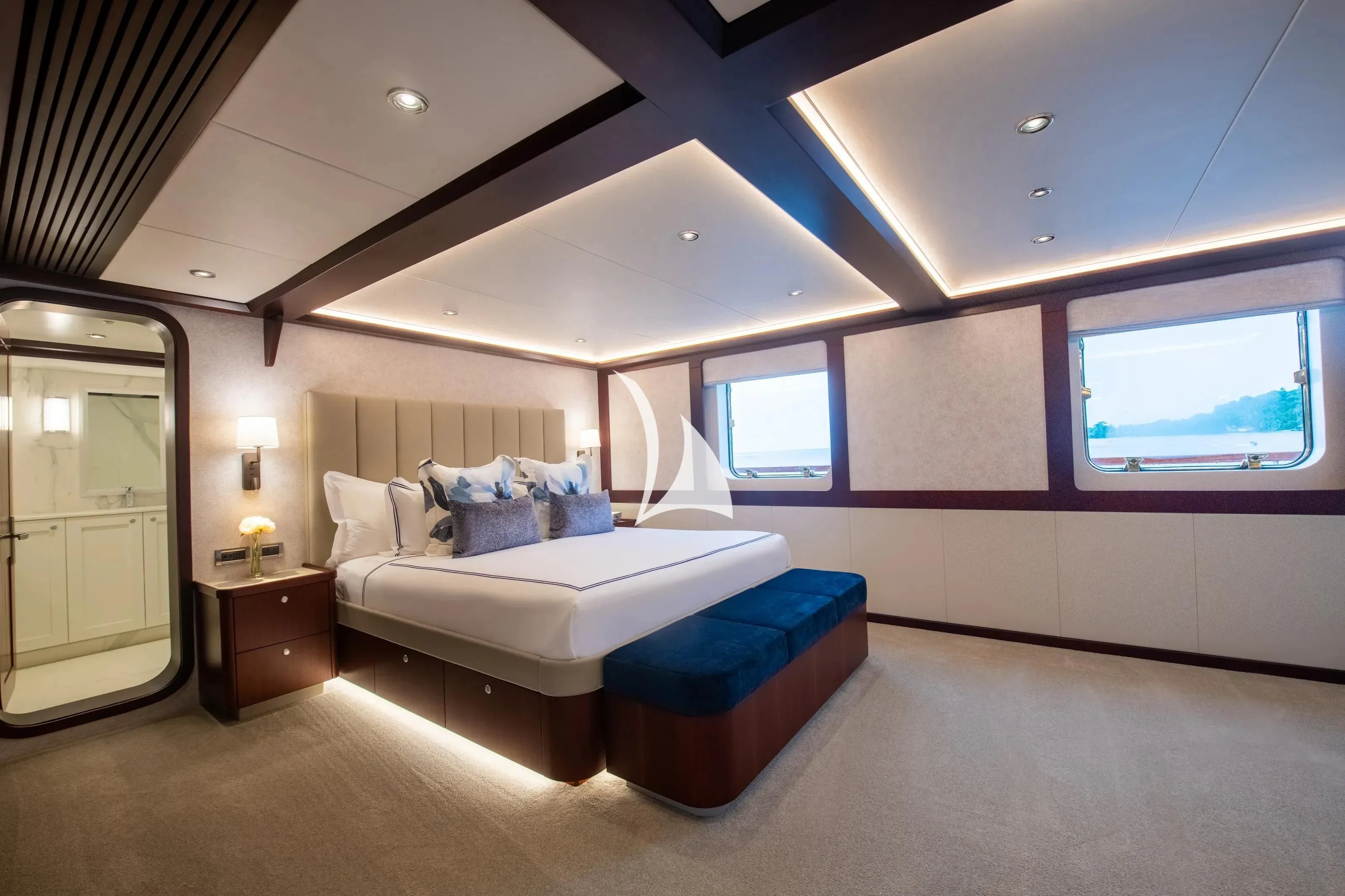 a bedroom with a bed and a window aboard LATITUDE Yacht for Sale