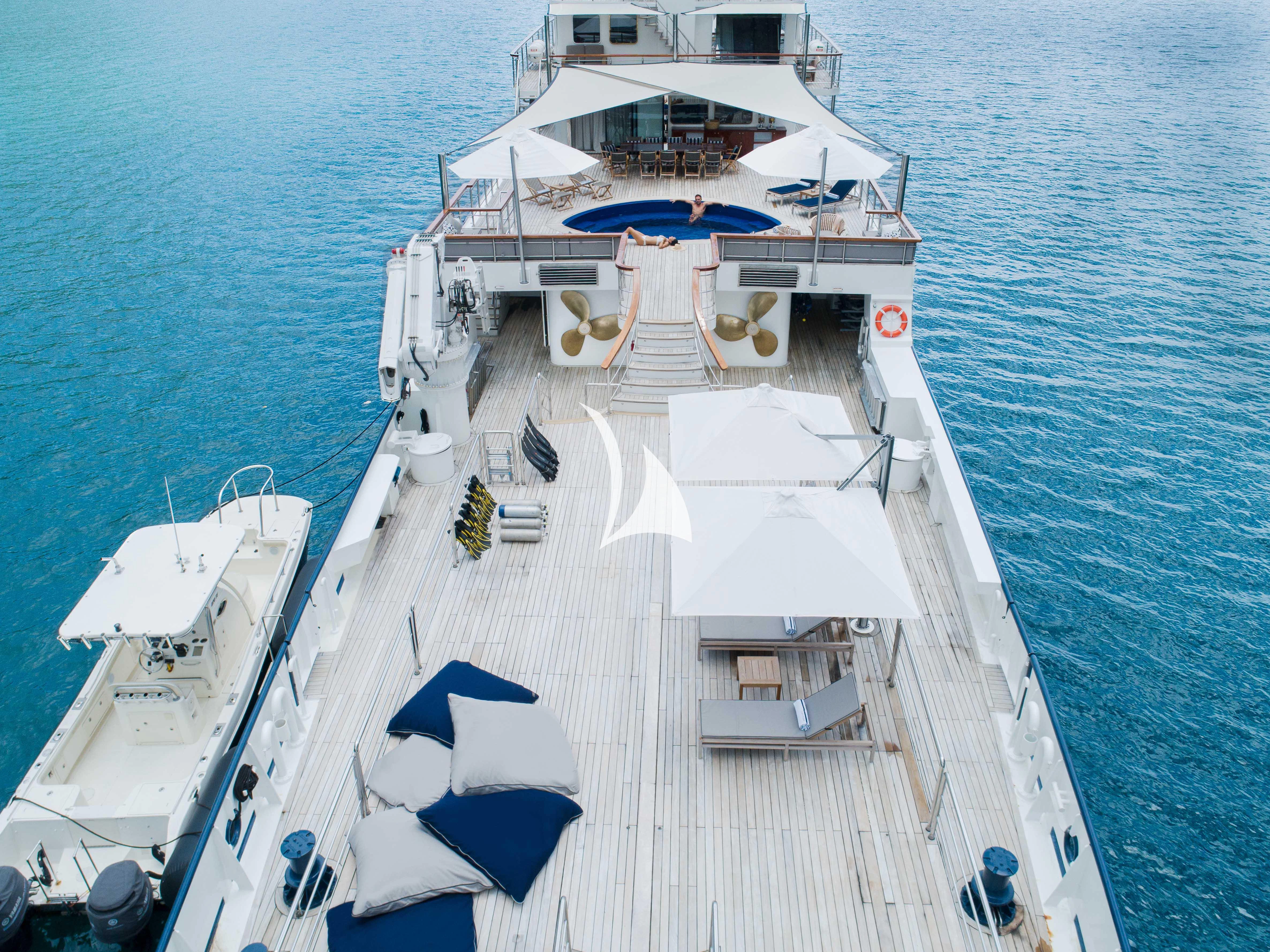 a large white ship with a blue and white stripe on it aboard LATITUDE Yacht for Sale