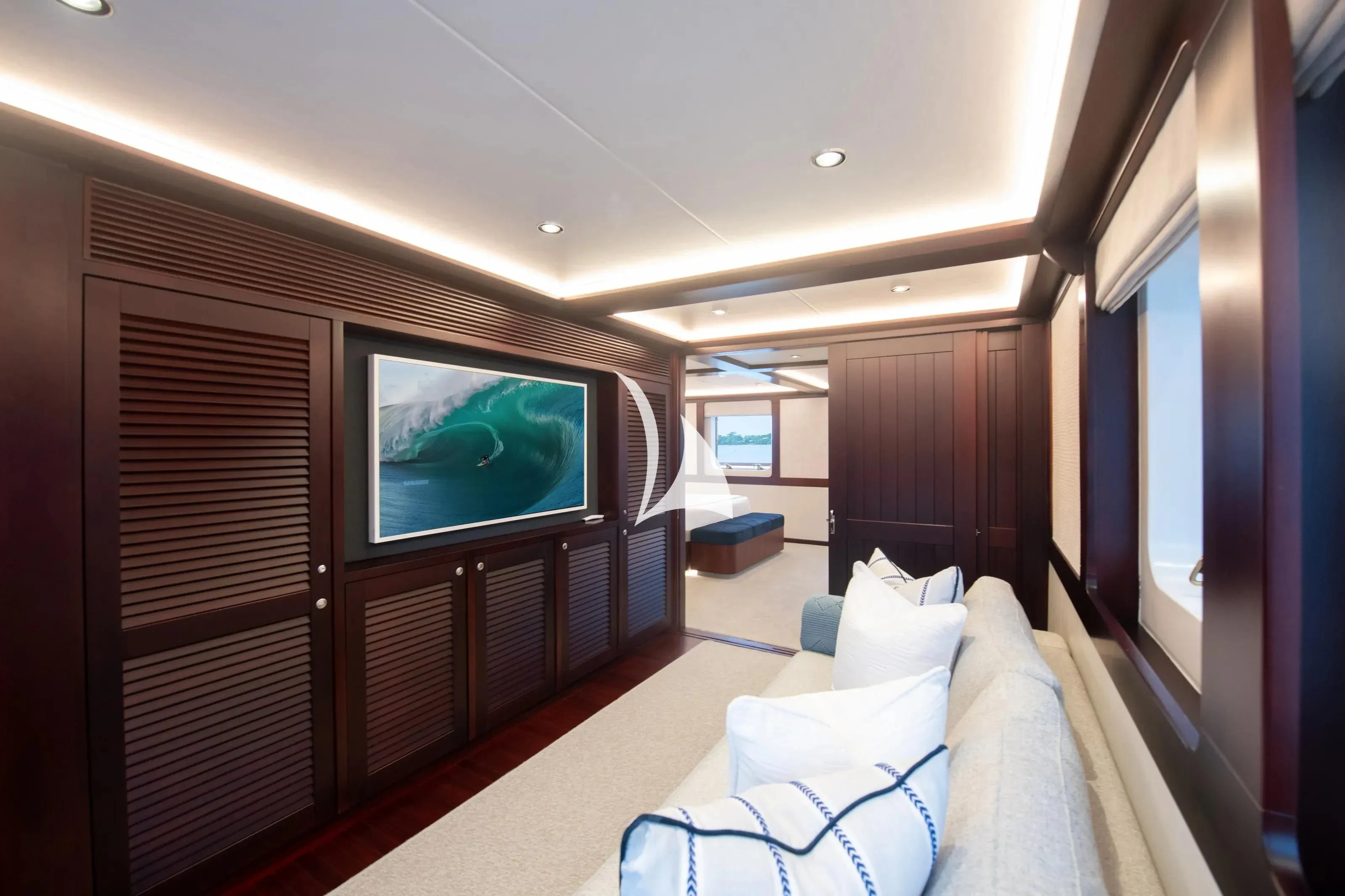 a room with a bed and a tv aboard LATITUDE Yacht for Sale