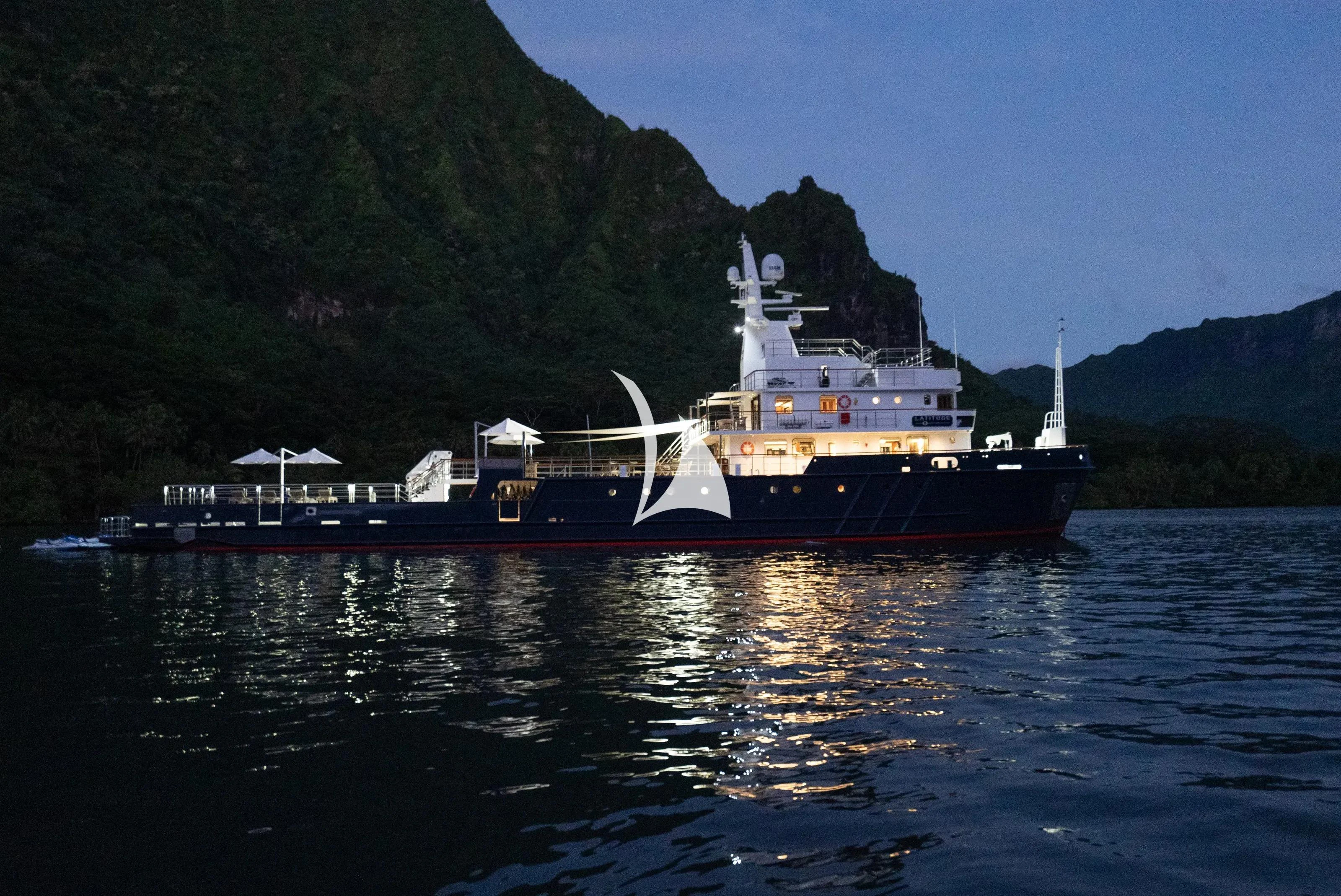 a large boat on the water aboard LATITUDE Yacht for Sale