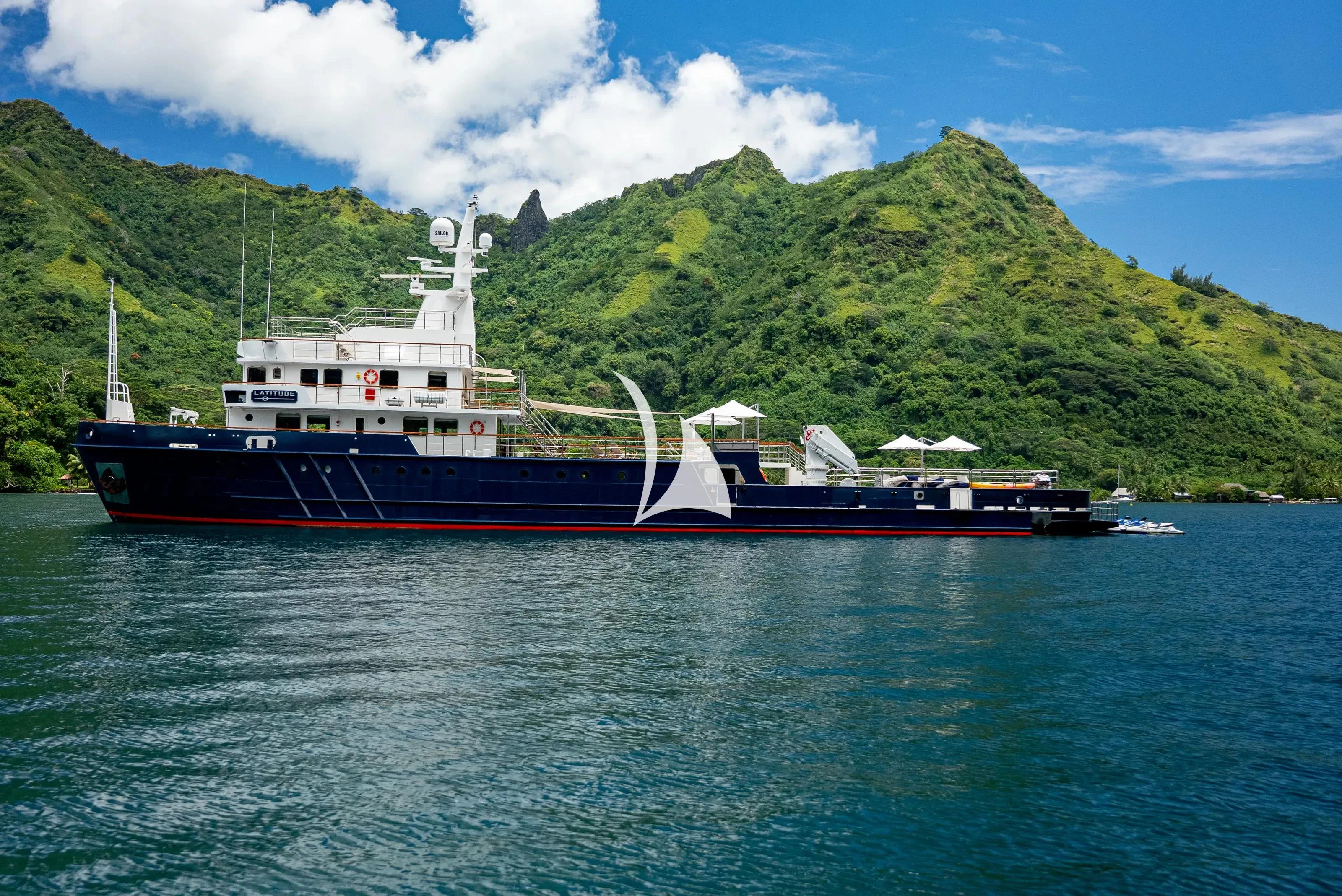 a large ship in the water aboard LATITUDE Yacht for Sale