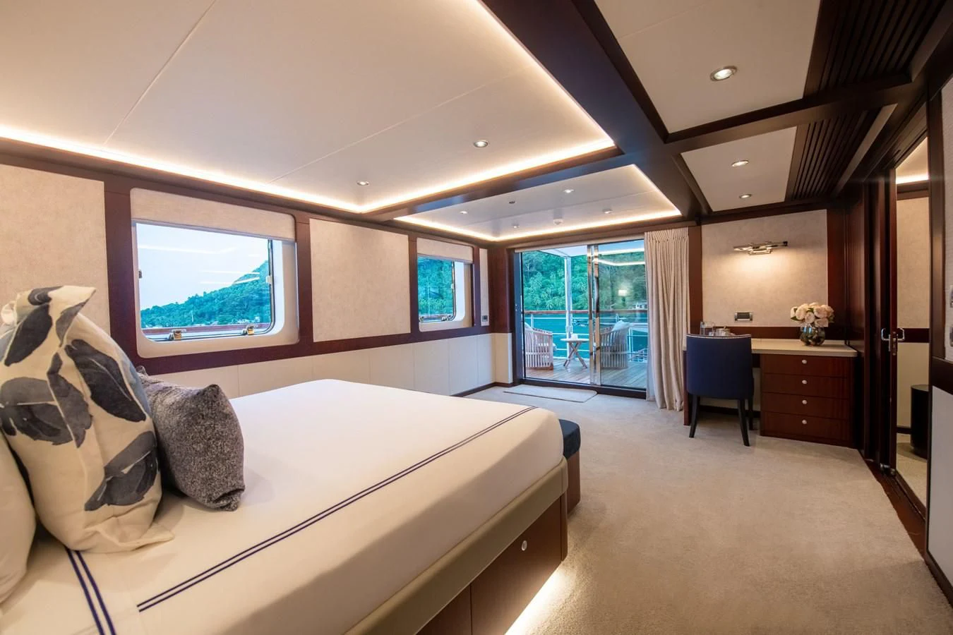 a bedroom with a large bed aboard LATITUDE Yacht for Sale