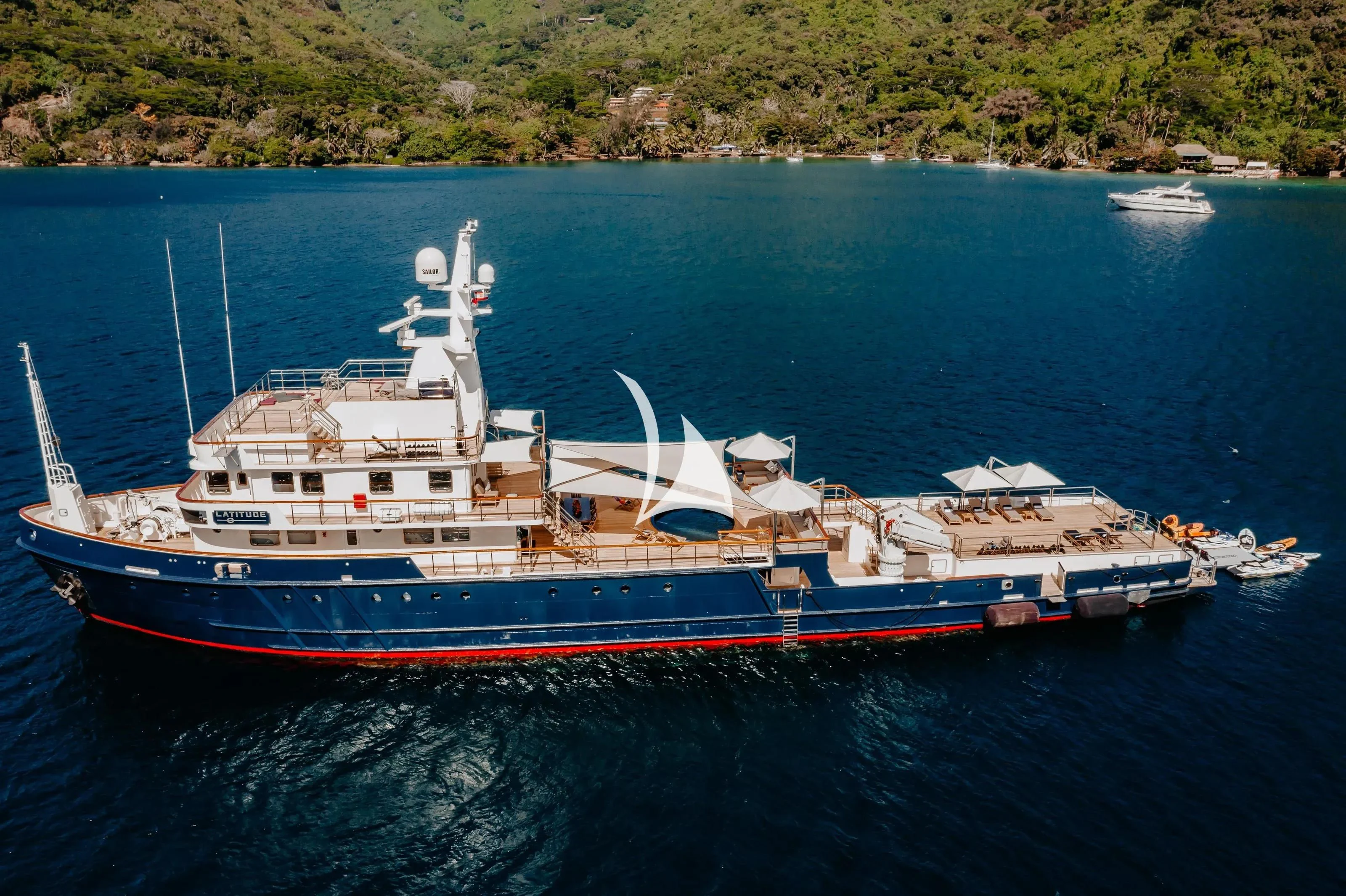 a large ship in the water aboard LATITUDE Yacht for Sale