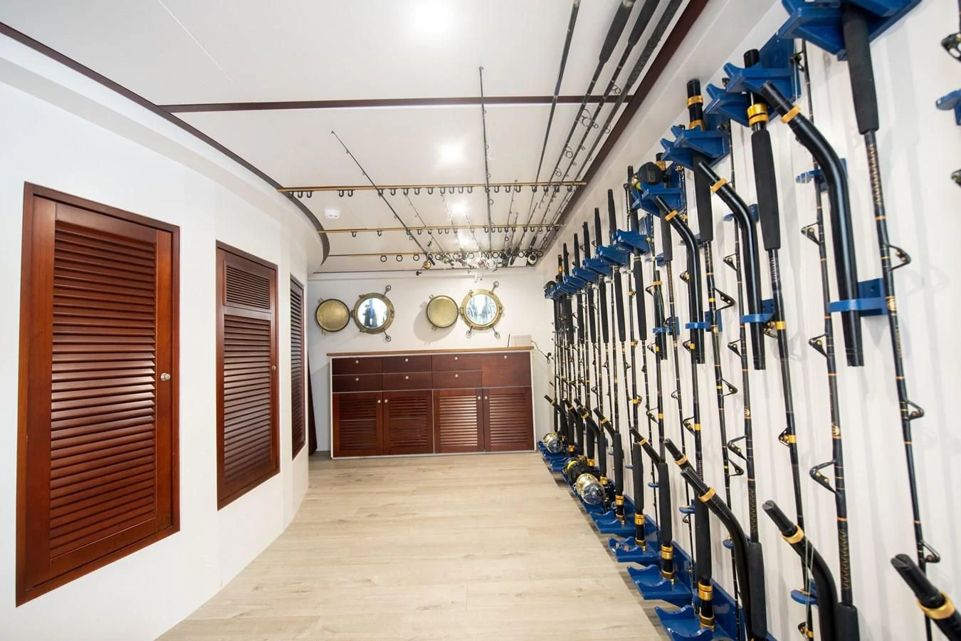 a room with many blue and white cables from the ceiling aboard LATITUDE Yacht for Sale